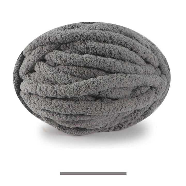 Oval ball of plush chunky yarn in medium gray, with a matching color swatch bar below. 24