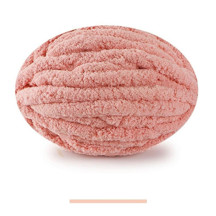 Single oval skein of salmon pink chunky yarn on a white background, with a color swatch bar below.