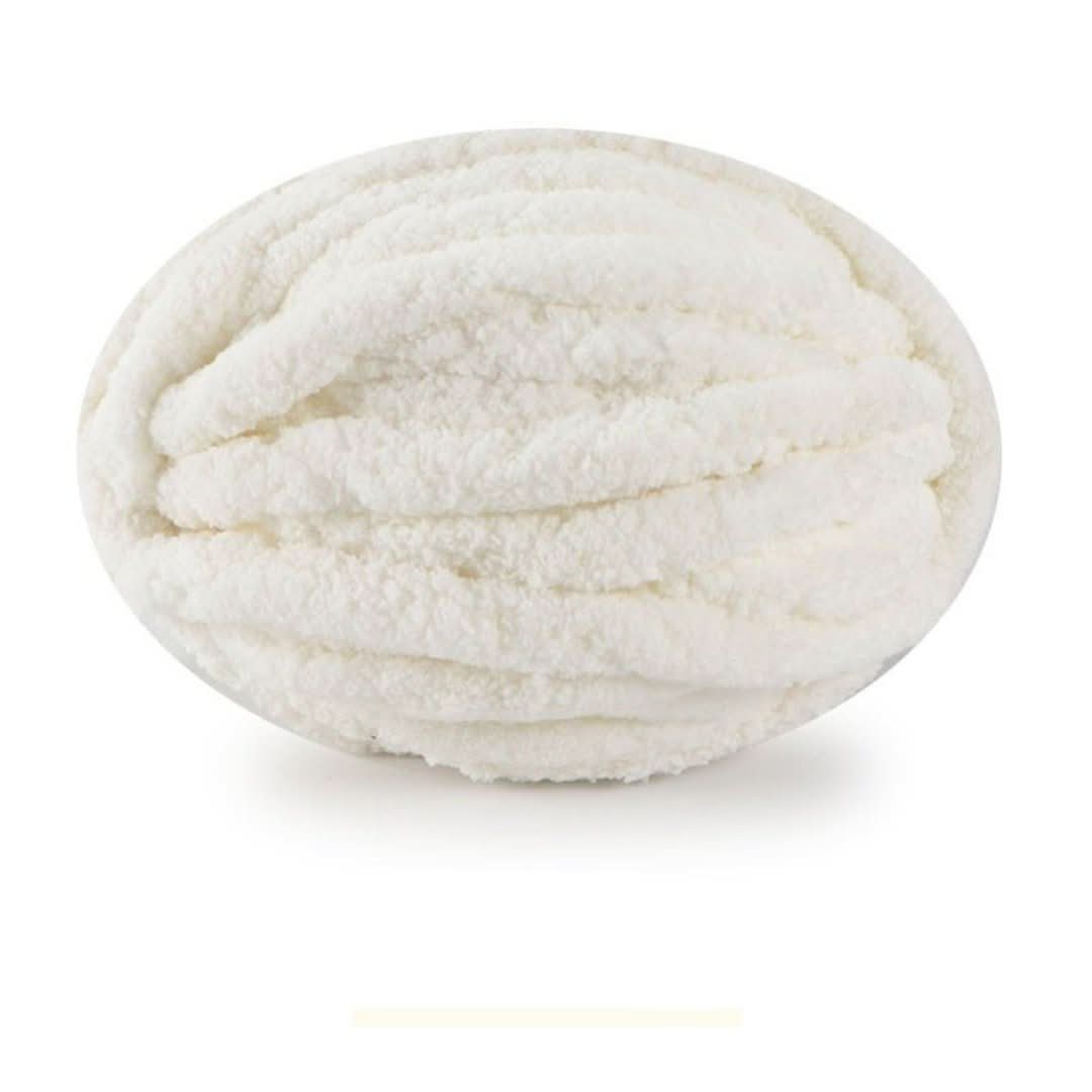 Single oval skein of creamy white chunky yarn on a white background, with a faint swatch bar below.