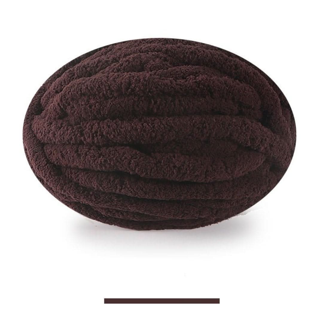 Single oval skein of dark brown chunky yarn on a white background, with a color swatch bar below.