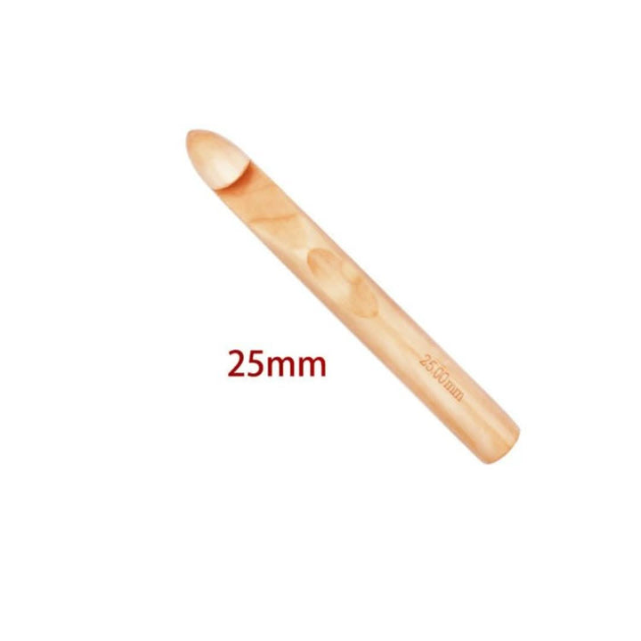 Large light wooden crochet hook with a rounded head and a smooth thick handle, shown on a white background. 27