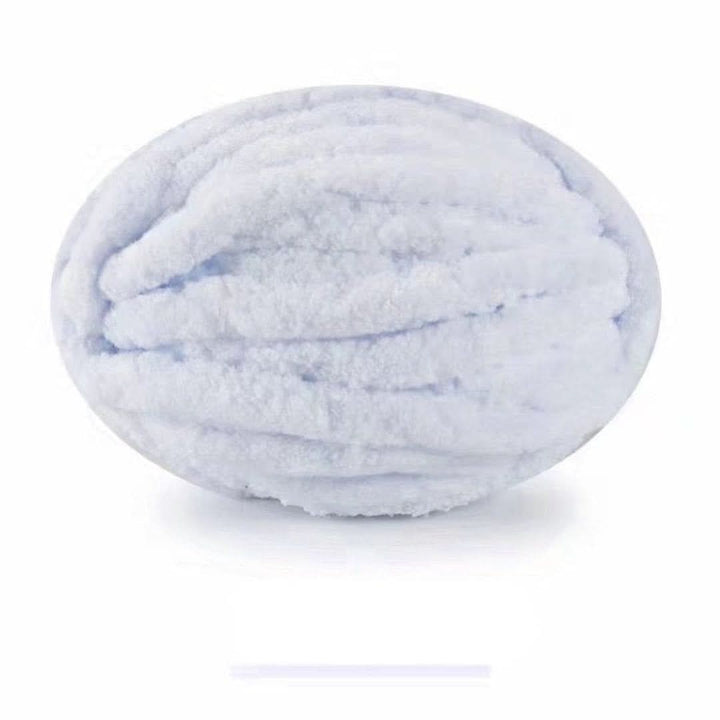 Oval ball of soft, fluffy chunky yarn in white with a faint icy blue tint. 25