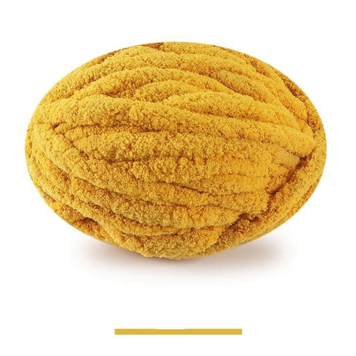 Single oval skein of mustard gold chunky yarn on a white background, with a color swatch bar below.