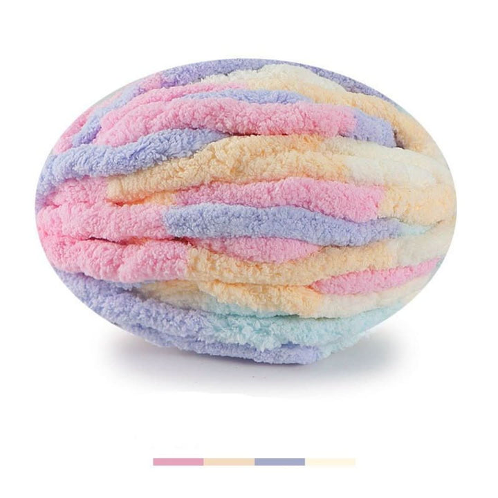 Oval ball of multicolor chunky yarn in pink, lavender, peach, cream and mint, with four color swatch bars below. 26