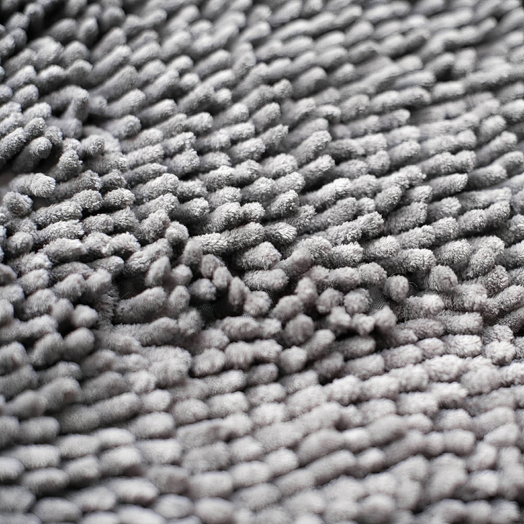 Grey chenille dog doormat detail of the soft tufts