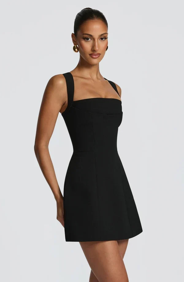 Black Isabeau Mini Dress with structured bodice and flared skirt, another view.