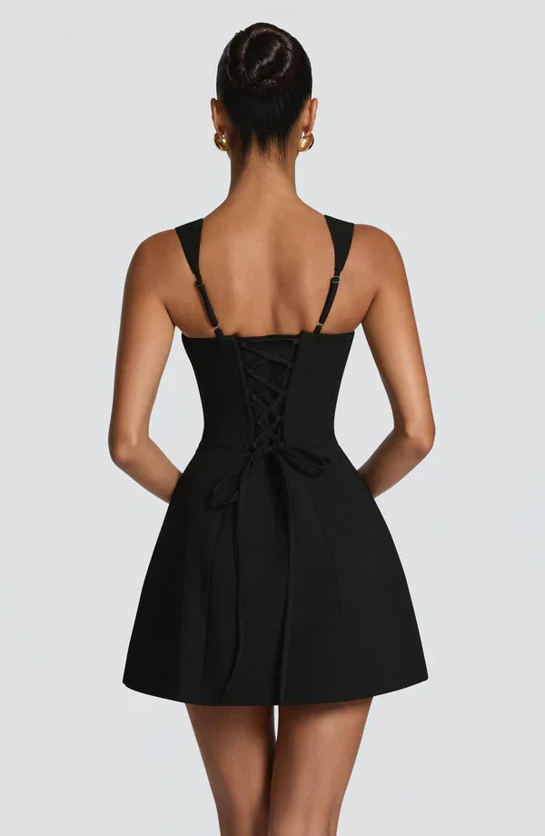 Black Isabeau Mini Dress with lace-up corset back and long ties, back view.