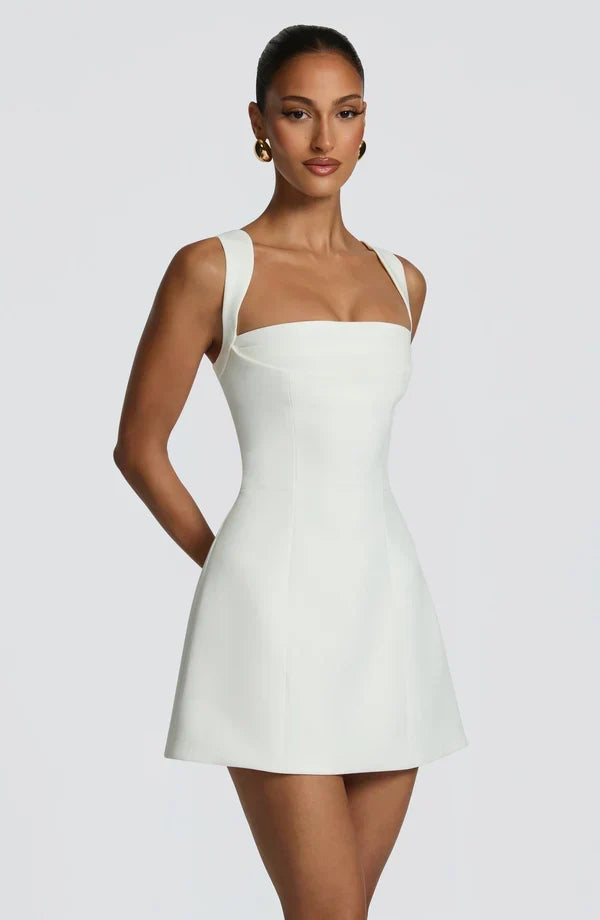Black Isabeau Mini Dress with structured corset bodice and flared skirt, detail view.