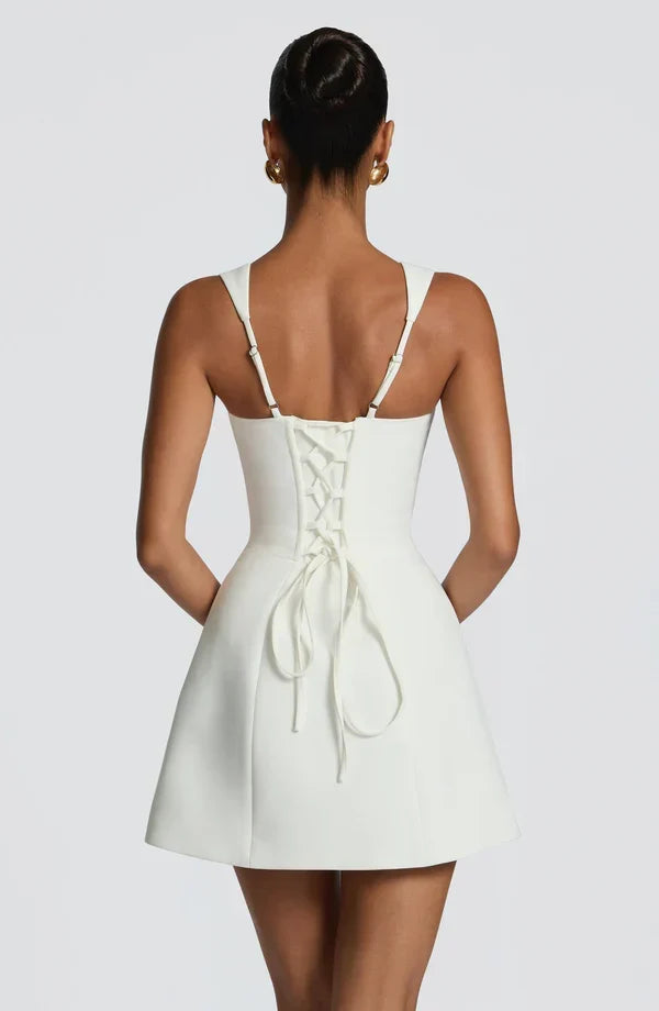 Black Isabeau Mini Dress with corset lace-up back and long ties, back view.