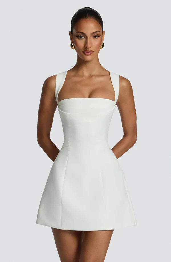 Black Isabeau Mini Dress with square neck and flared skirt, front view.