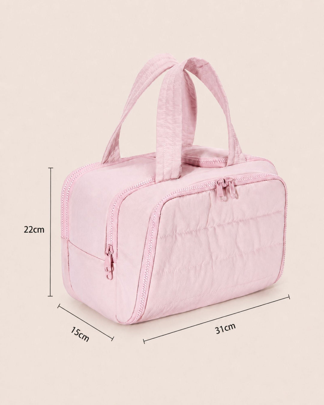 Pink quilted bag at a three-quarter angle with dimension lines marking its height, width and depth.