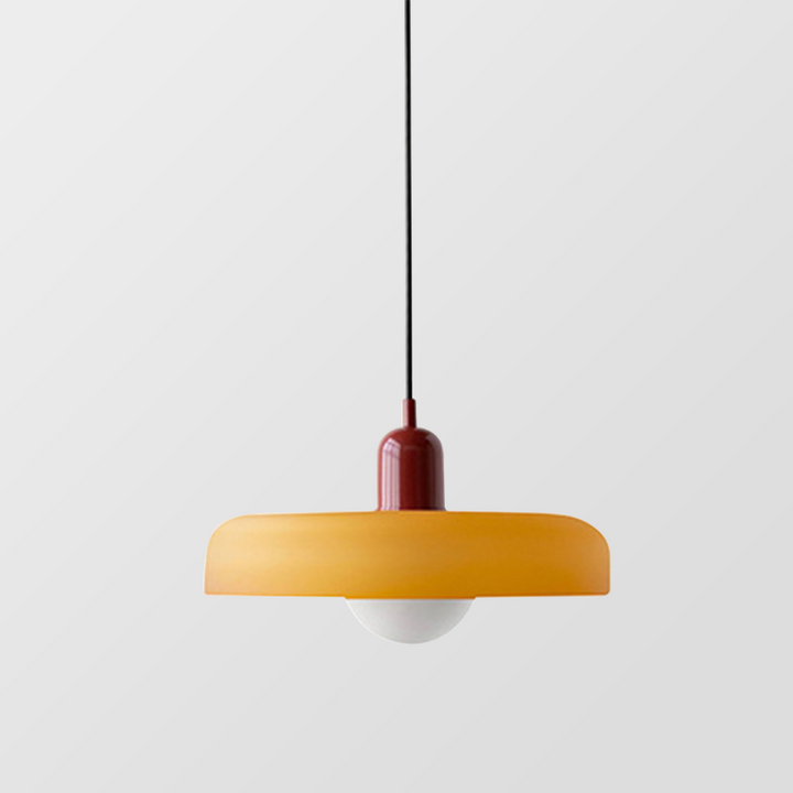 Amber glass shade with a red cap and exposed round bulb on a plain gray background 22
