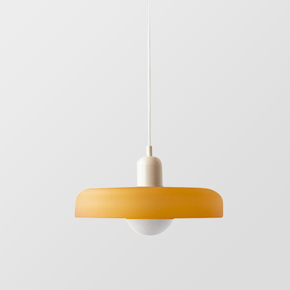 Amber shade with a cream cap and white cord against a light gray backdrop 32