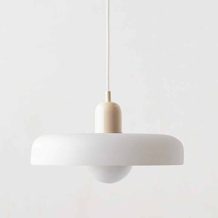 Large white disc pendant with beige cap and white cord against a light wall 48