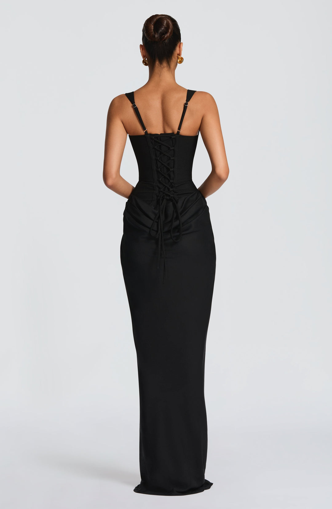 Indy Bodycon Maxi Dress in black, back view with a lace-up back and draped hip fabric.
