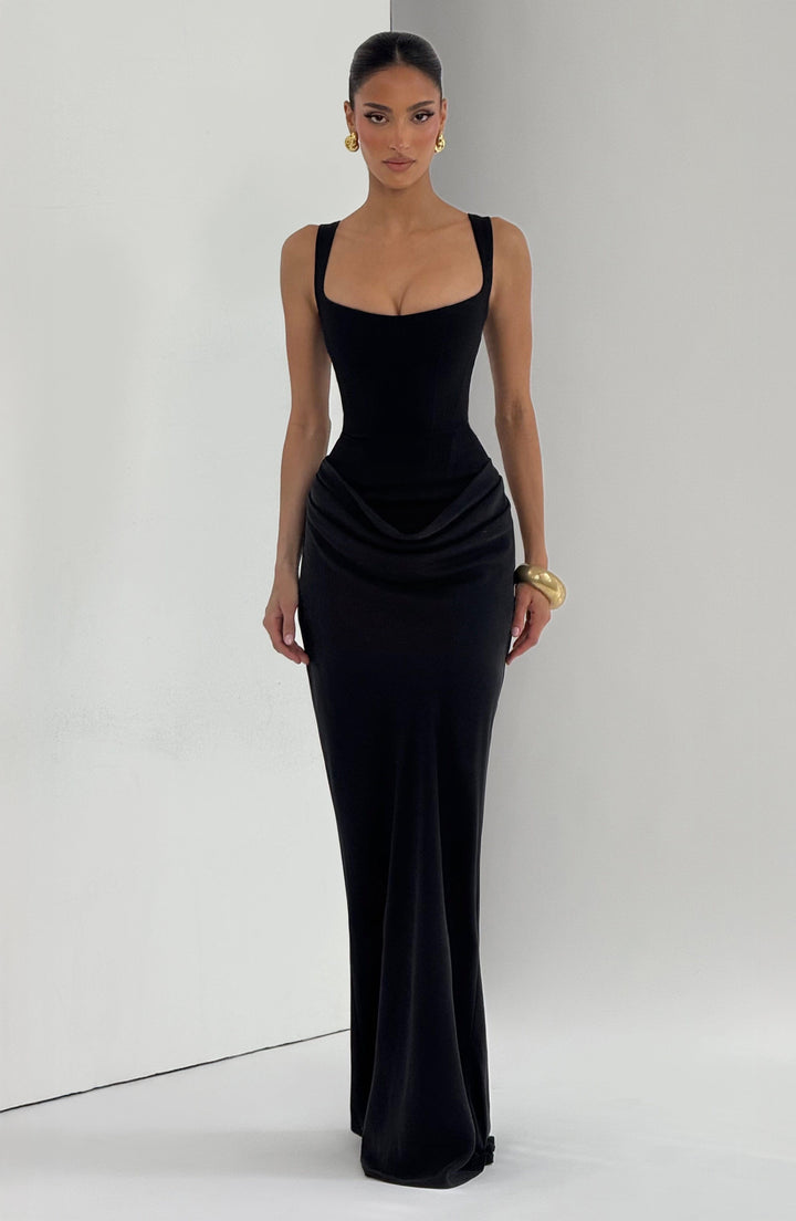 Indy Bodycon Maxi Dress in black, full-length front view with a fitted silhouette and flowing hem.