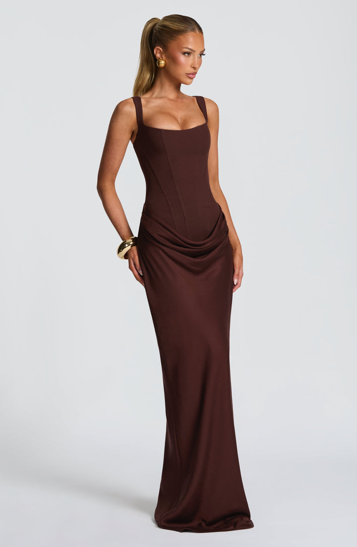 Indy Bodycon Maxi Dress in brown, three-quarter view with a scoop neckline and structured bodice.