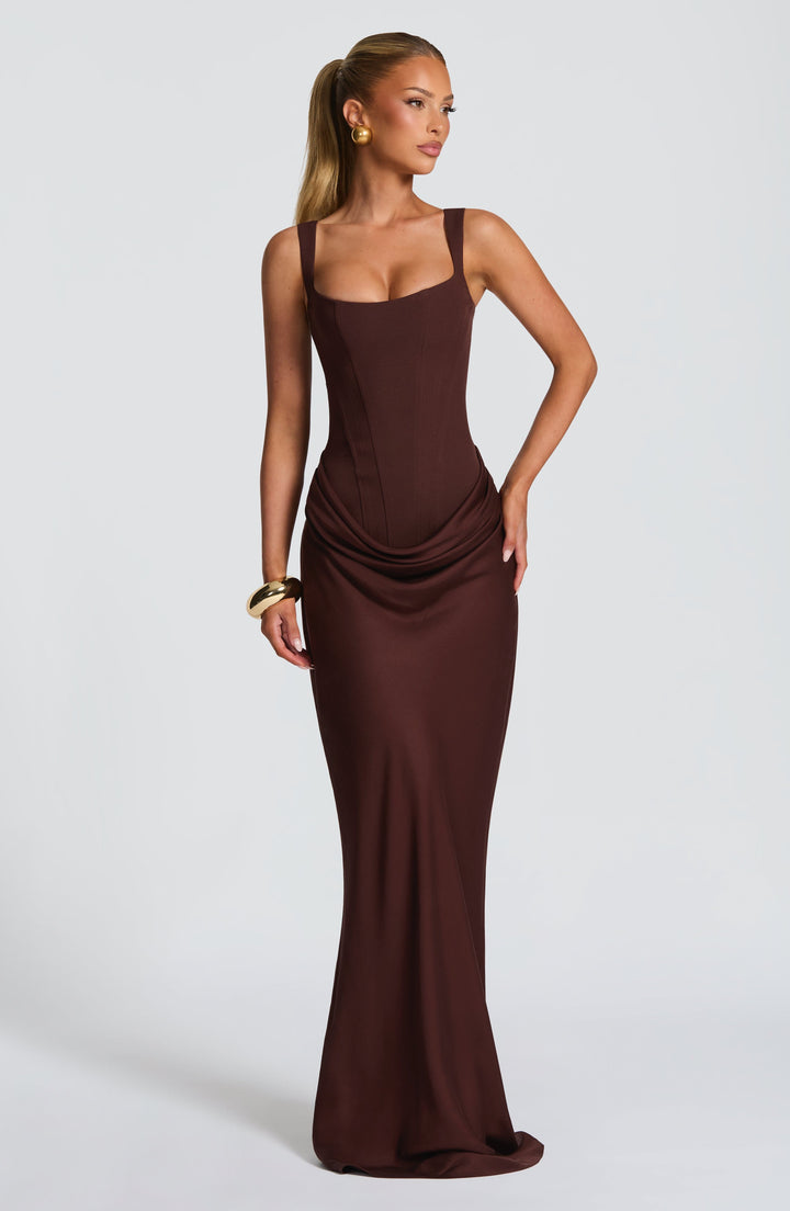Indy Bodycon Maxi Dress in brown, full-length front view with a fitted skirt and train.