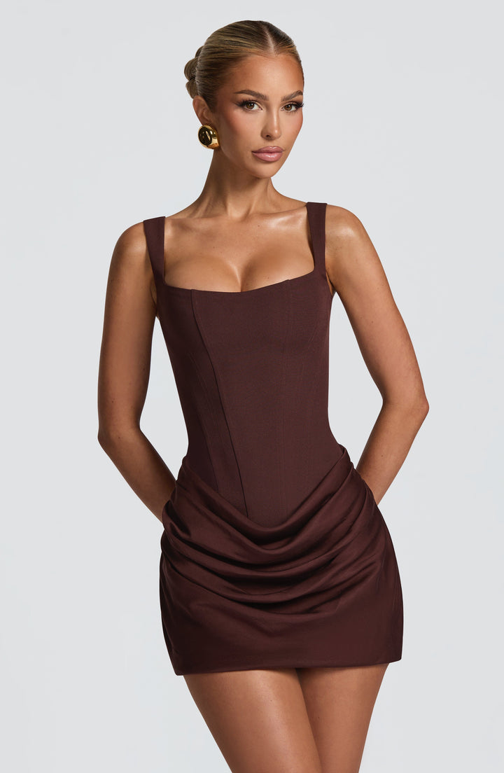 Indy Bodycon Mini Dress in brown with a front view, square neckline and draped skirt.
