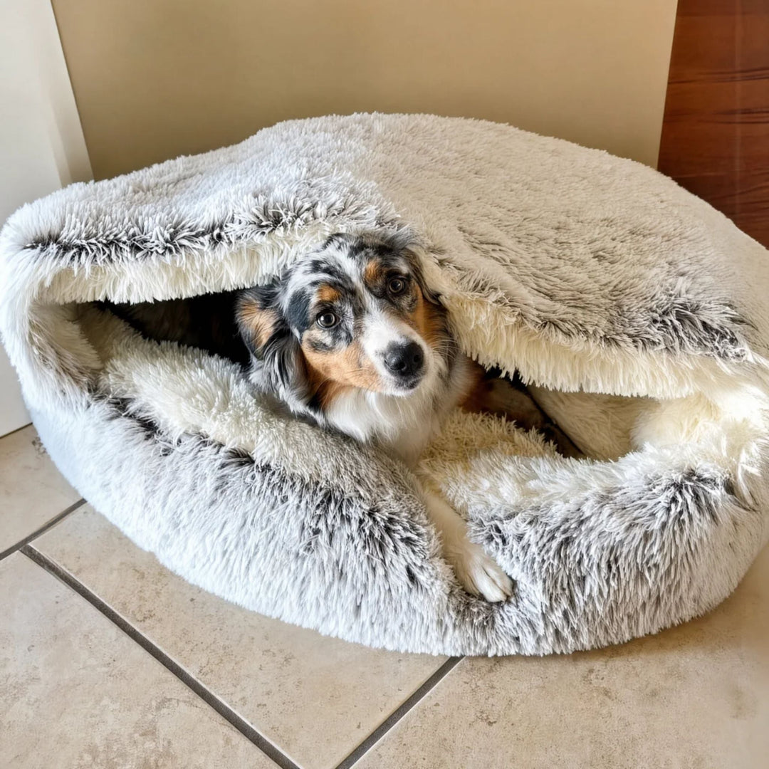 Large gray and white plush cave bed with the hood lifted