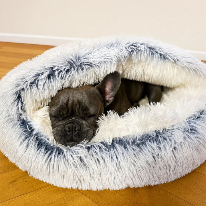 White and gray shaggy plush cave bed with the hood folded over