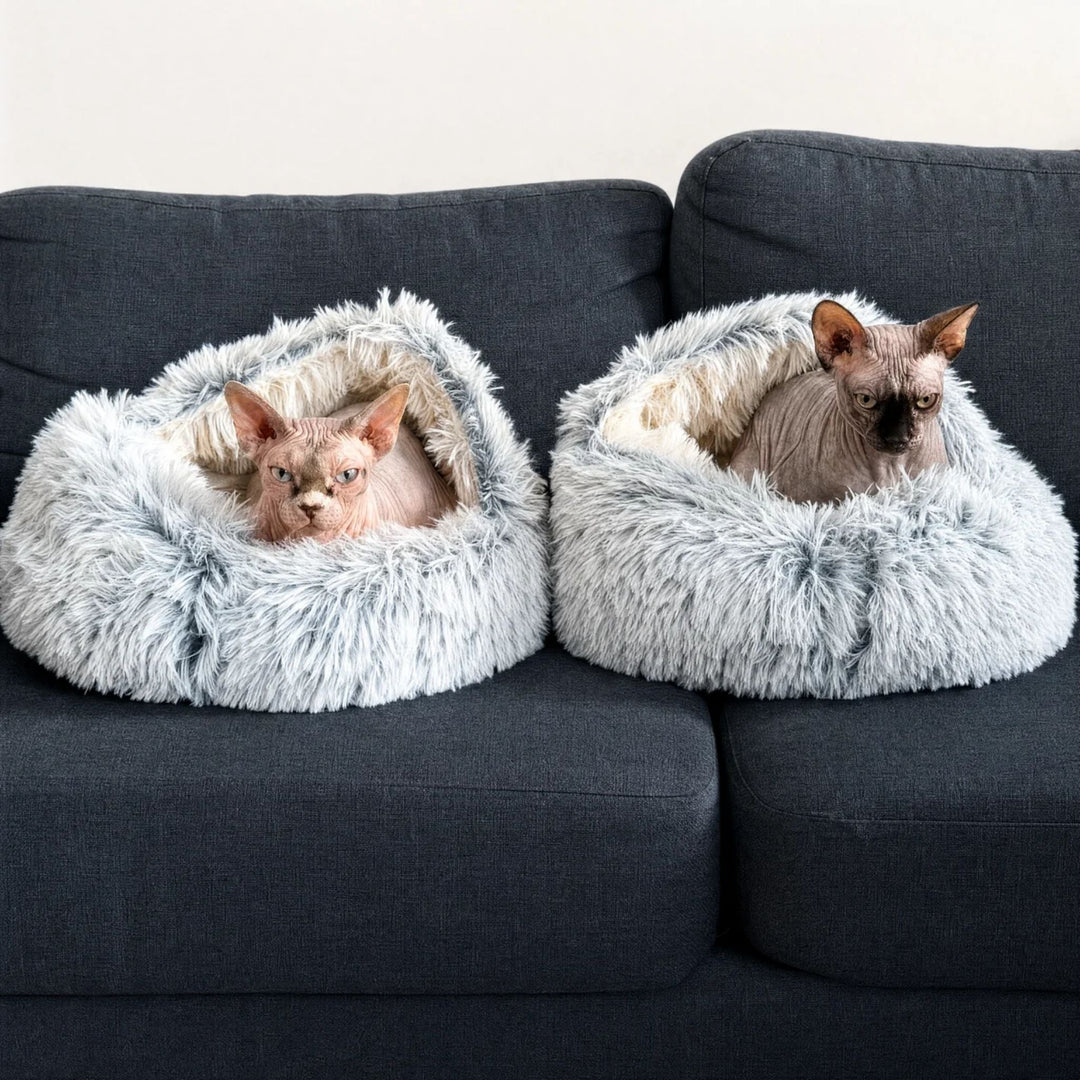 Two gray and white fluffy hooded beds side by side