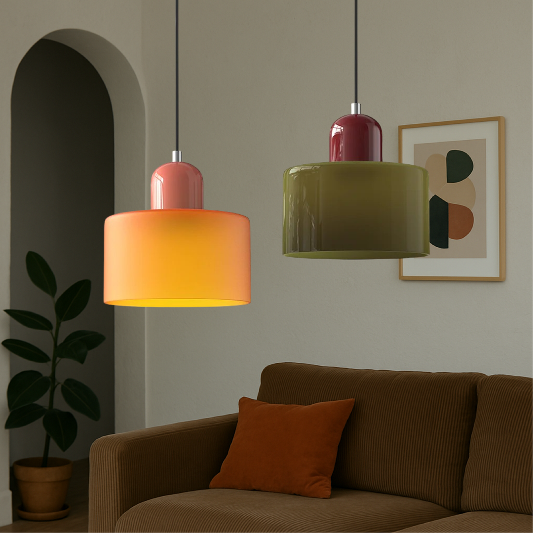 Orange pendant with coral cap and olive green pendant with burgundy cap hanging in a living room above a corduroy sofa. 4