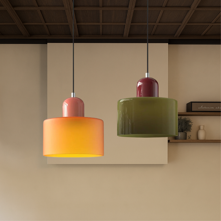 Orange and olive green pendant lights hanging in front of a beige wall below a dark wood coffered ceiling. 5