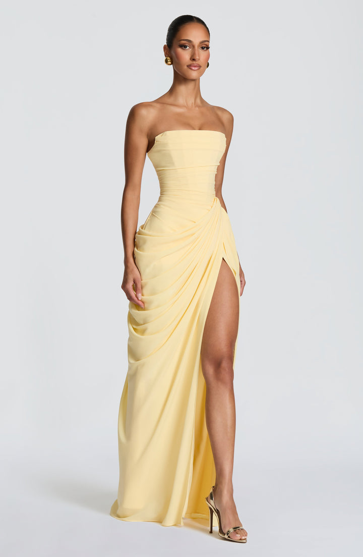 Lois Strapless Corset Maxi Dress with High Slit in pale yellow, three-quarter front view