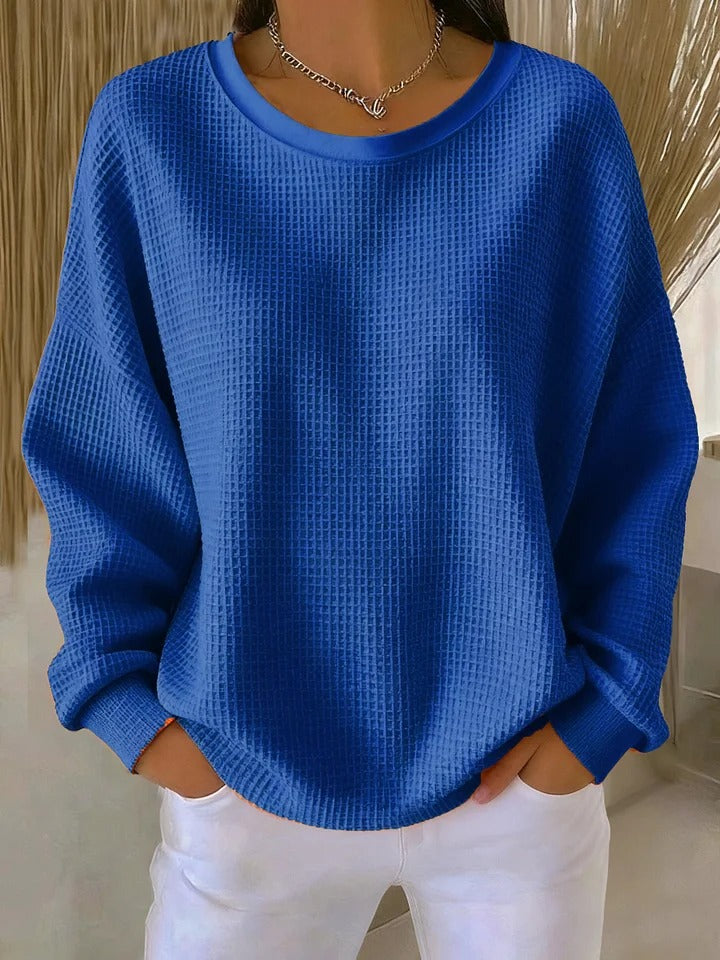 Royal blue long-sleeve sweater with a ribbed round neckline and cuffs.
