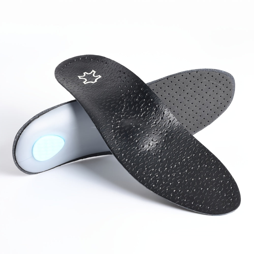 Pair of black perforated insoles crossed on a white background, one showing its top surface and the other its underside with a clear arch shell and blue heel pa