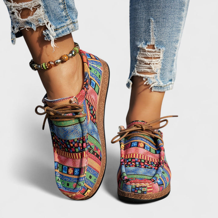 Front and side detail of colorful striped and checked lace-up sneakers in blue, green, pink and orange.