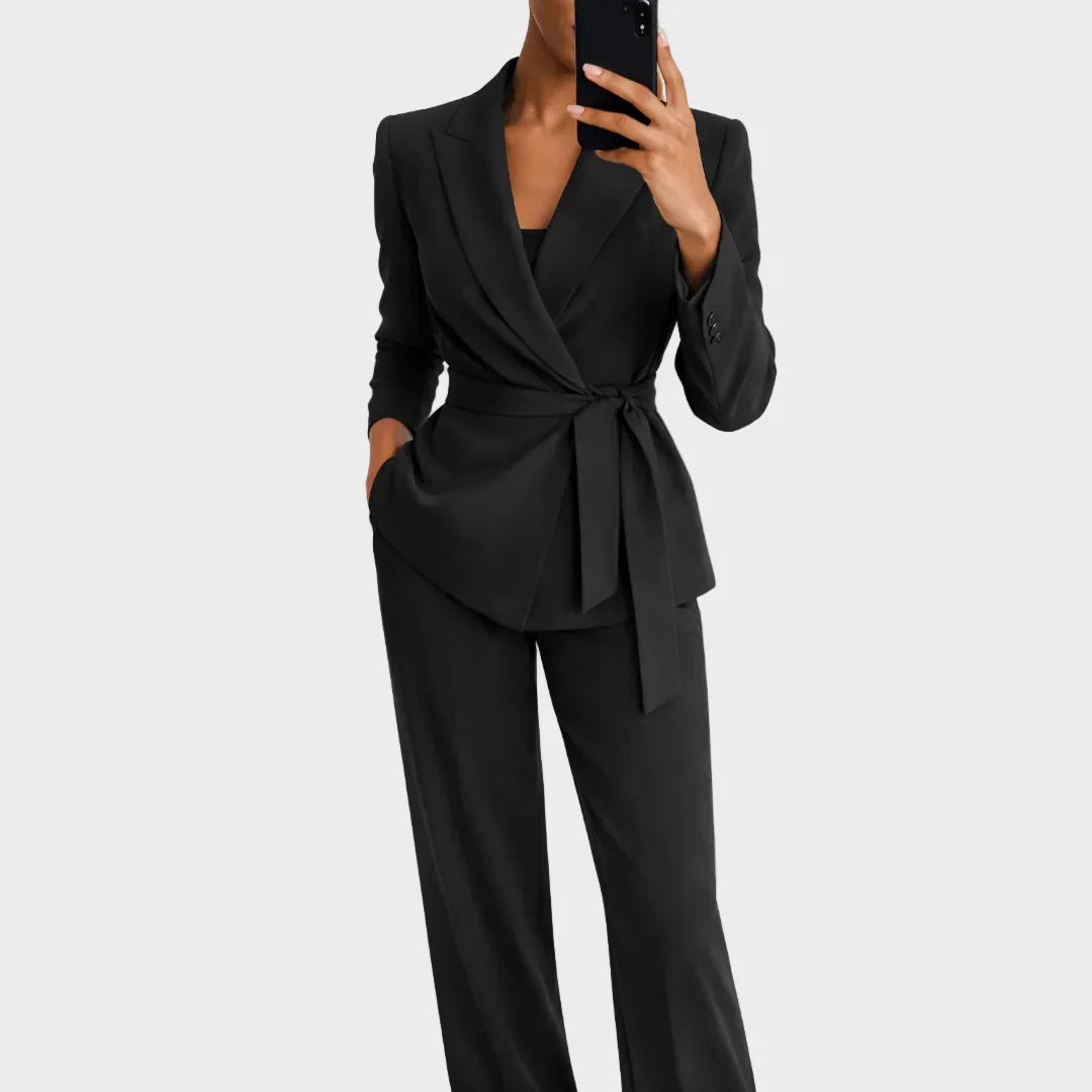 Women's matching blazer and pants set in black, shown in another view with a wrap front and tie belt.