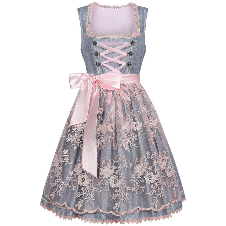 Green dirndl dress with a pink floral lace overskirt, pink ribbon lacing, satin bow and scalloped trim.