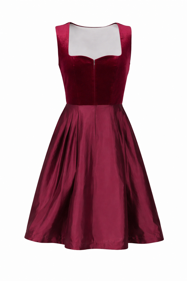 Front view of the dirndl dress without the apron, showing the velvet bodice with sweetheart neckline, front zipper and pleated satin skirt.