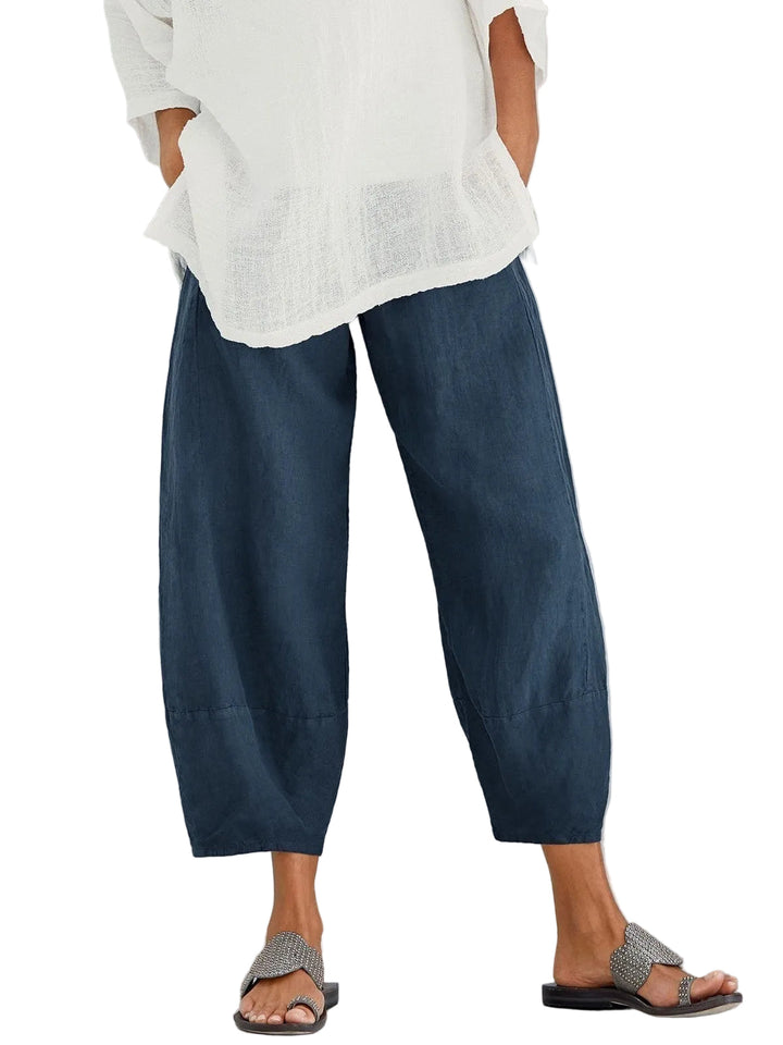 Navy blue cropped wide-leg pants with a seam below the knee