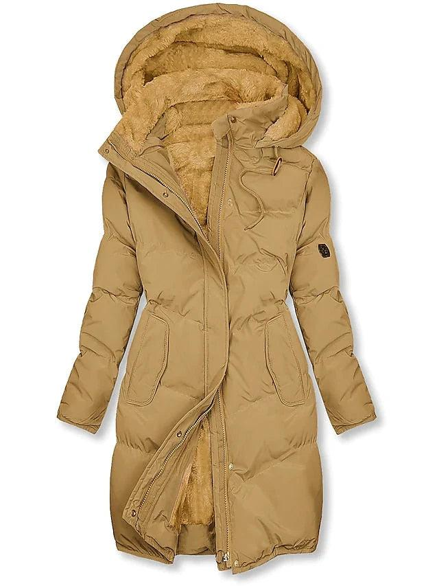 Tan quilted long coat with plush fleece lining visible in the hood and open front zipper, shown flat with drawstring and pockets. 1