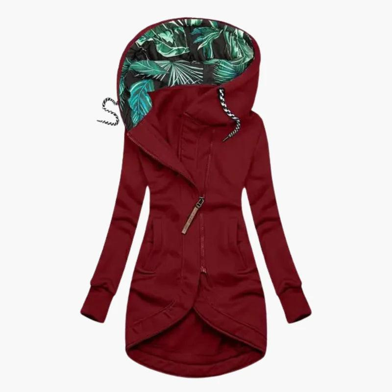 Burgundy red version of the jacket, front view, featuring tropical leaf hood lining, diagonal zipper, front pockets and curved hem.
