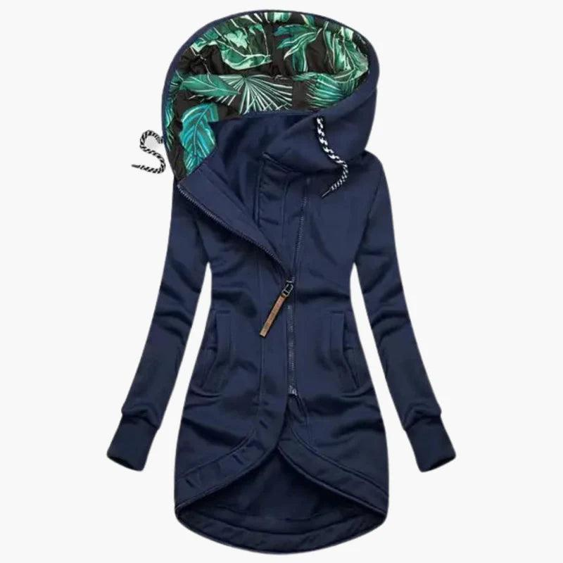 Navy blue version of the jacket, front view, with leaf-print hood lining, braided drawstrings, slanted zipper and long fitted sleeves.