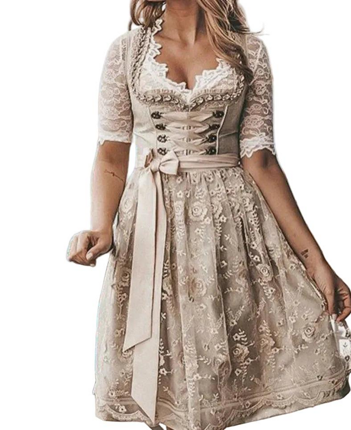 Women’s traditional dirndl dress in beige with lace sleeves, lace-up bodice and floral apron, front view.