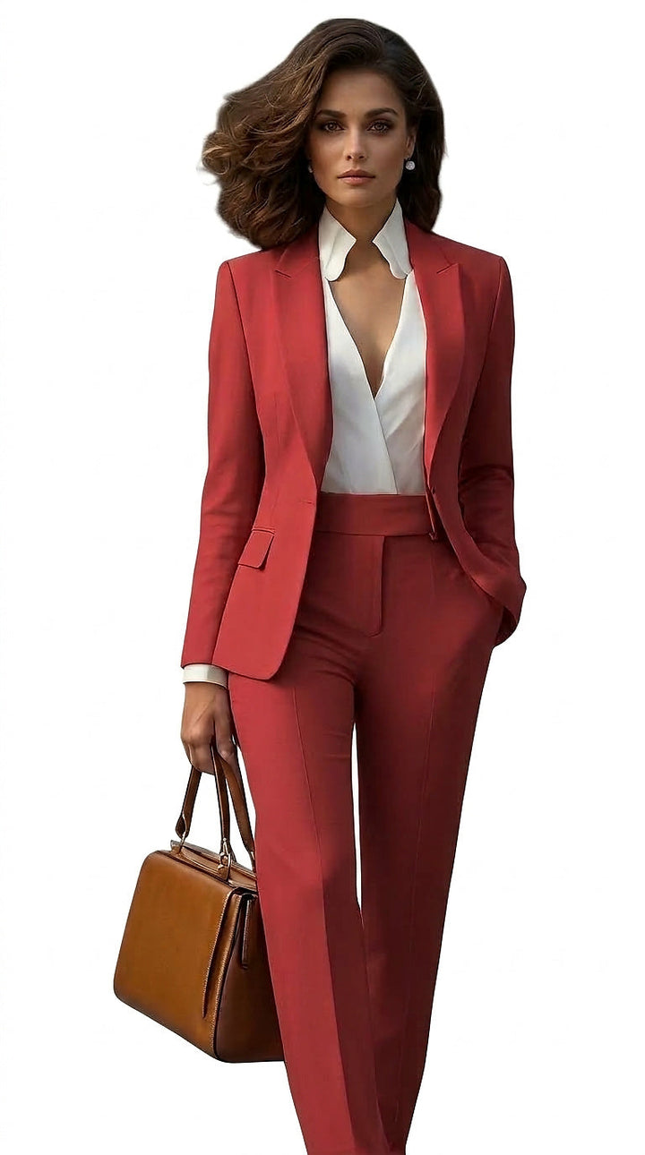 Model in a coral-red single-breasted blazer and matching pants, white blouse, holding a tan handbag 1