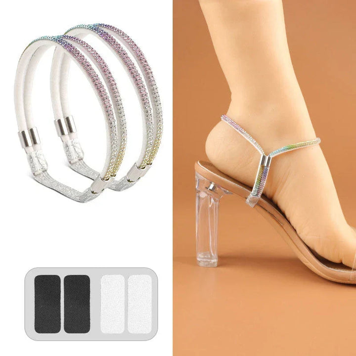 Pair of pastel rainbow gradient crystal shoe straps with adhesive pads worn around the ankle of a clear-heeled sandal.