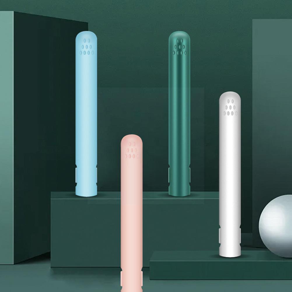 Four closed straighteners in blue, green, white and pink standing on green blocks in a studio scene 4