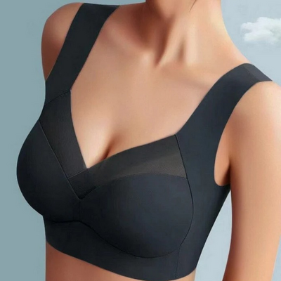 Model wearing a black seamless bra with wide straps and a sheer mesh V-neck panel 3