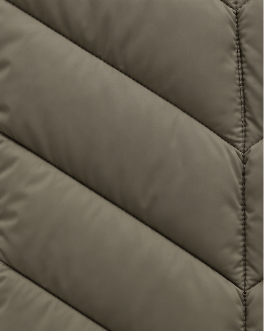 Women's Hooded Quilted Puffer Jacket detail of the chevron quilting with smooth padded channels and stitched seam down the center.