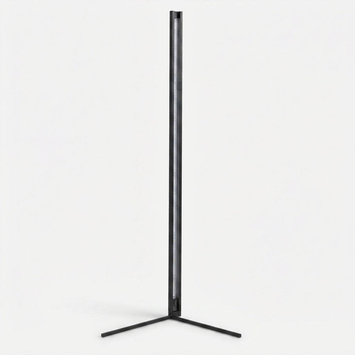 Black lamp switched off against a plain white background, showing the slim tube with its LED strip and the two-legged base. 11