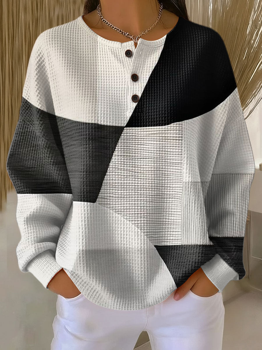 Waffle knit henley in black, gray and white geometric color-block design, worn by a model 2