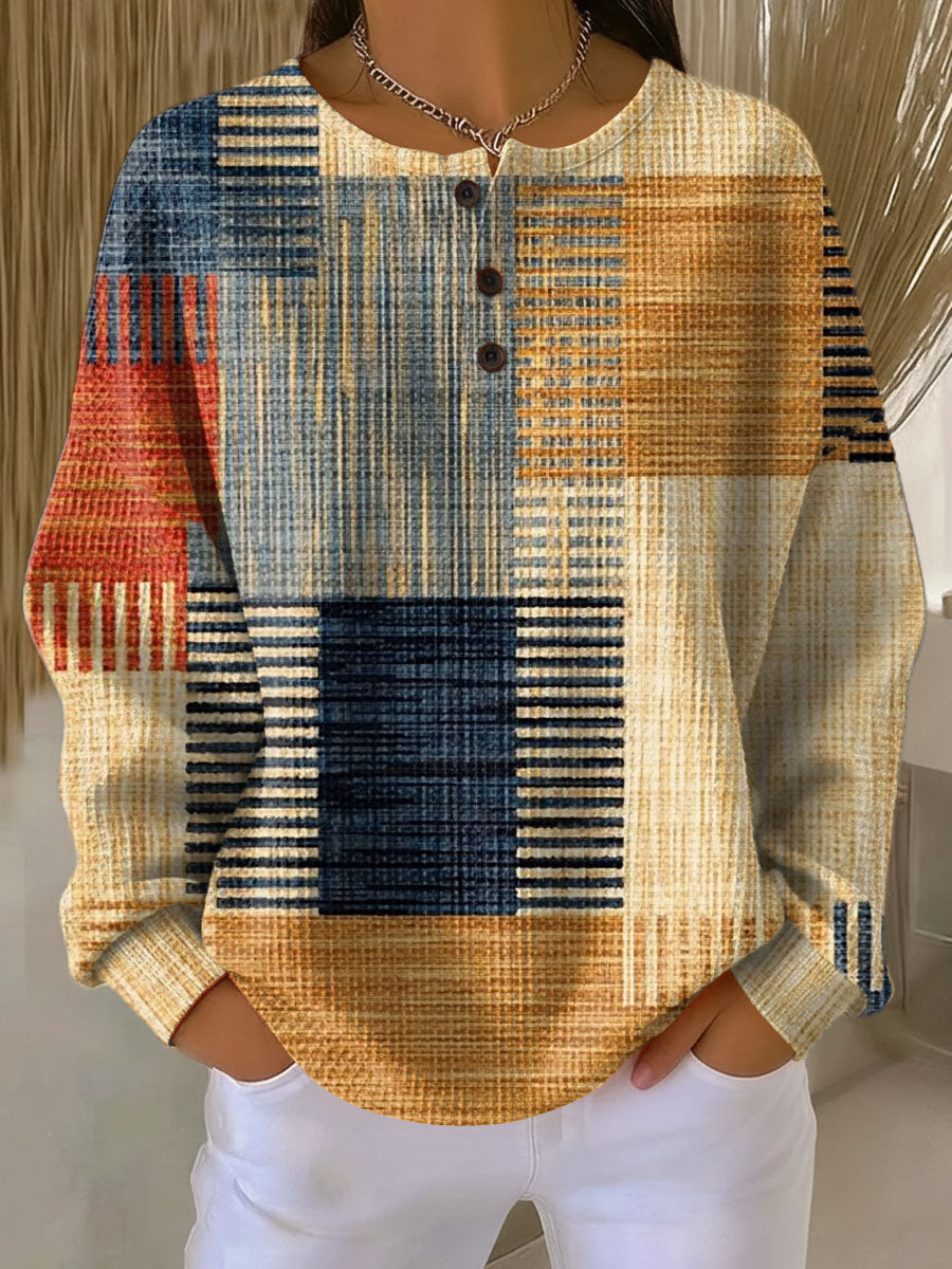 Waffle knit henley with mustard, navy, rust and light blue striped patchwork pattern, worn by a model 3