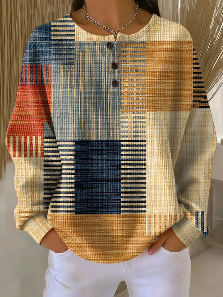 Waffle knit henley with mustard, navy, rust and light blue striped patchwork pattern, worn by a model 3