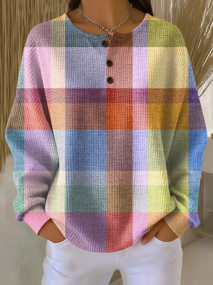 Waffle knit henley in pastel plaid with pink, purple, blue, orange and yellow blocks, worn by a model 9